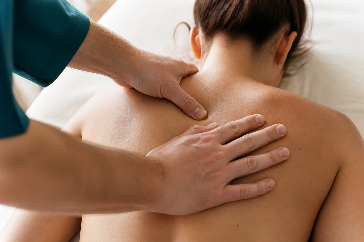 Close-up of hands-on chiropractic care